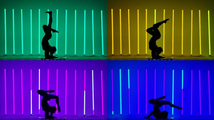 运动员在霓虹灯的背景下表演体操。
