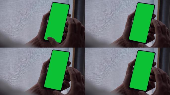 轻触并握住绿色屏幕智能手机