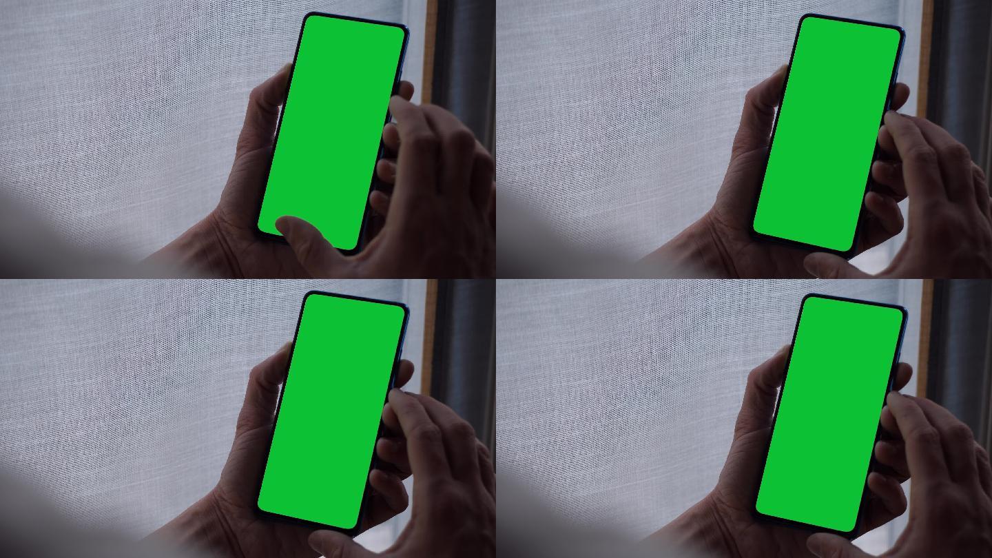 轻触并握住绿色屏幕智能手机