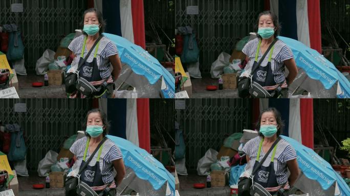 戴口罩的小贩防护服抗击疫情新冠病毒