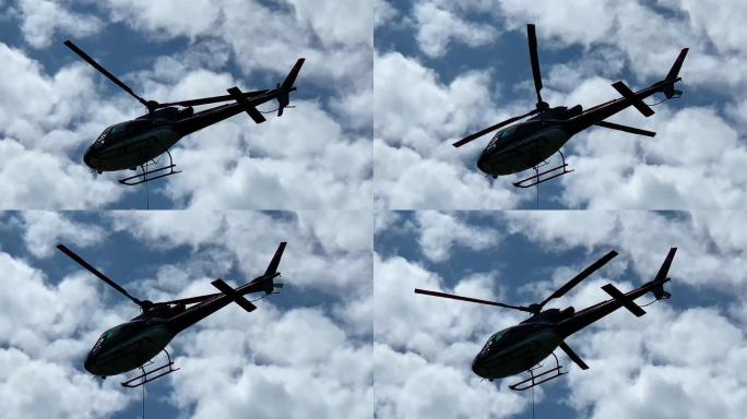 直升机在蓝天白云中飞行