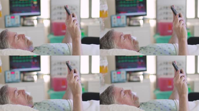 患者使用手机外国老人生病病床孤寡老人