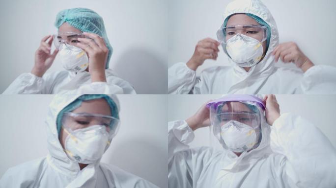 亚洲女性护士穿着白色PPE西装