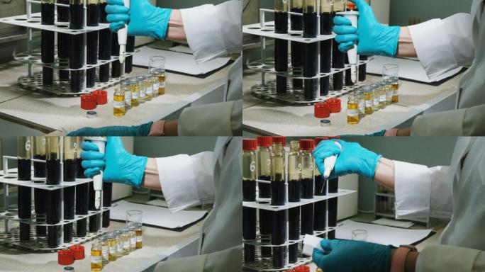 实验室助理用器具取少量黄色液体