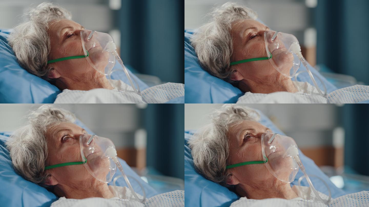 医院病房：戴着氧气面罩躺在床上的老妇人
