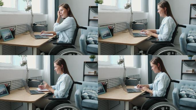残疾女性在公寓里用笔记本电脑打视频电话