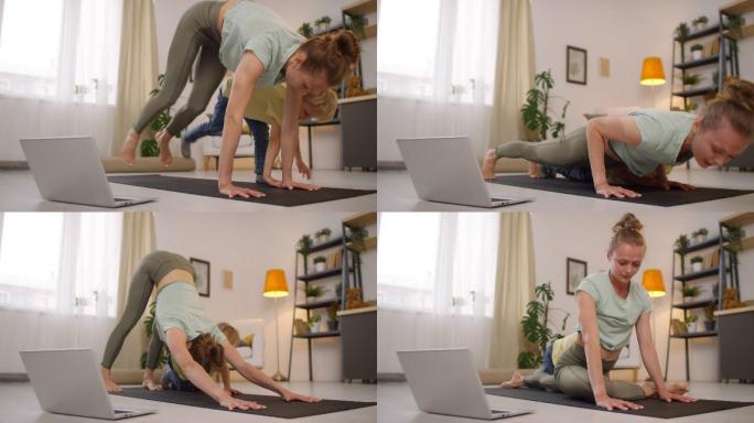 在家练瑜伽的女人亲子锻炼居家瑜伽练习健康