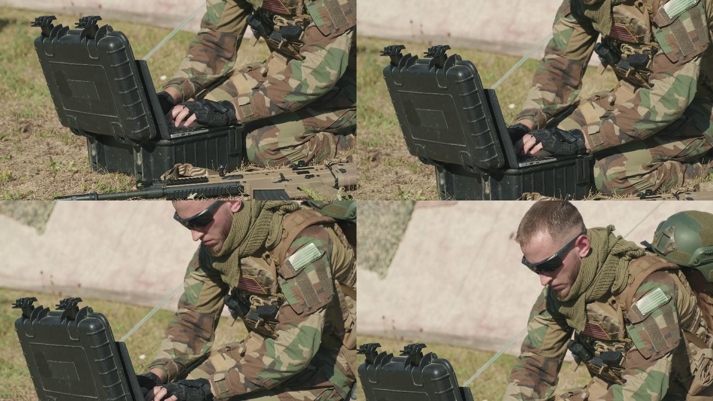 军事监视官员在笔记本电脑上打字-模拟拍摄