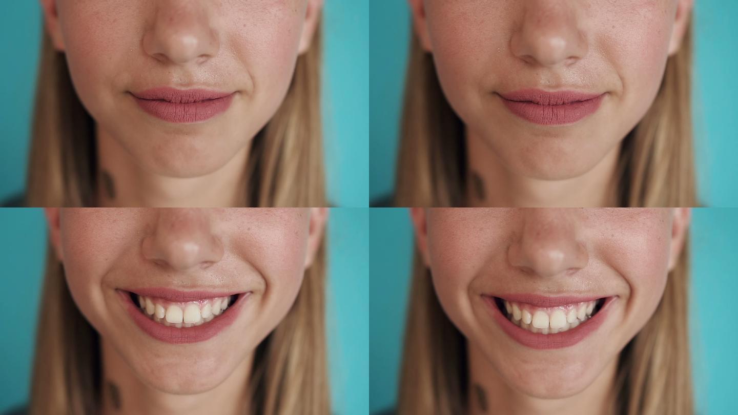 白色健康牙齿的女性微笑特写镜头
