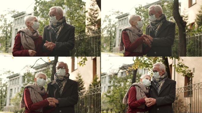 戴着口罩走路的老年夫妇