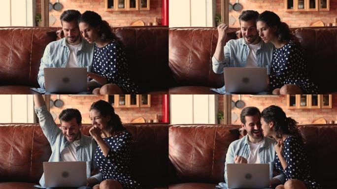 夫妇俩在电脑上阅读电子邮件庆祝