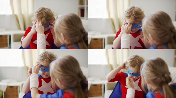 帮哥哥戴超级英雄面具的女孩