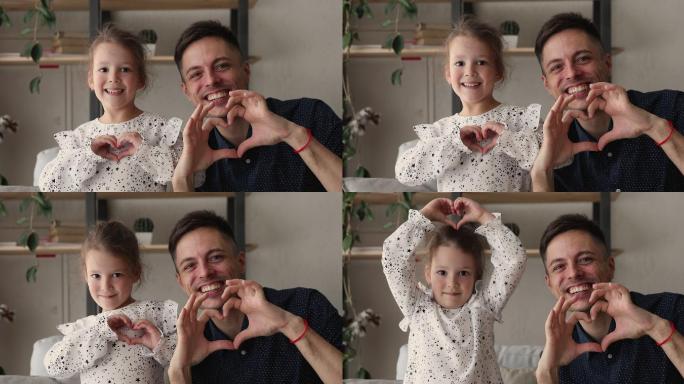 爸爸和小女儿用手指做心形