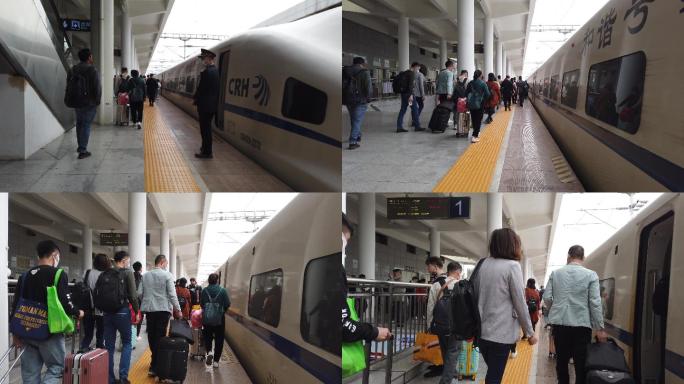 旅客在动车站台上车乘车