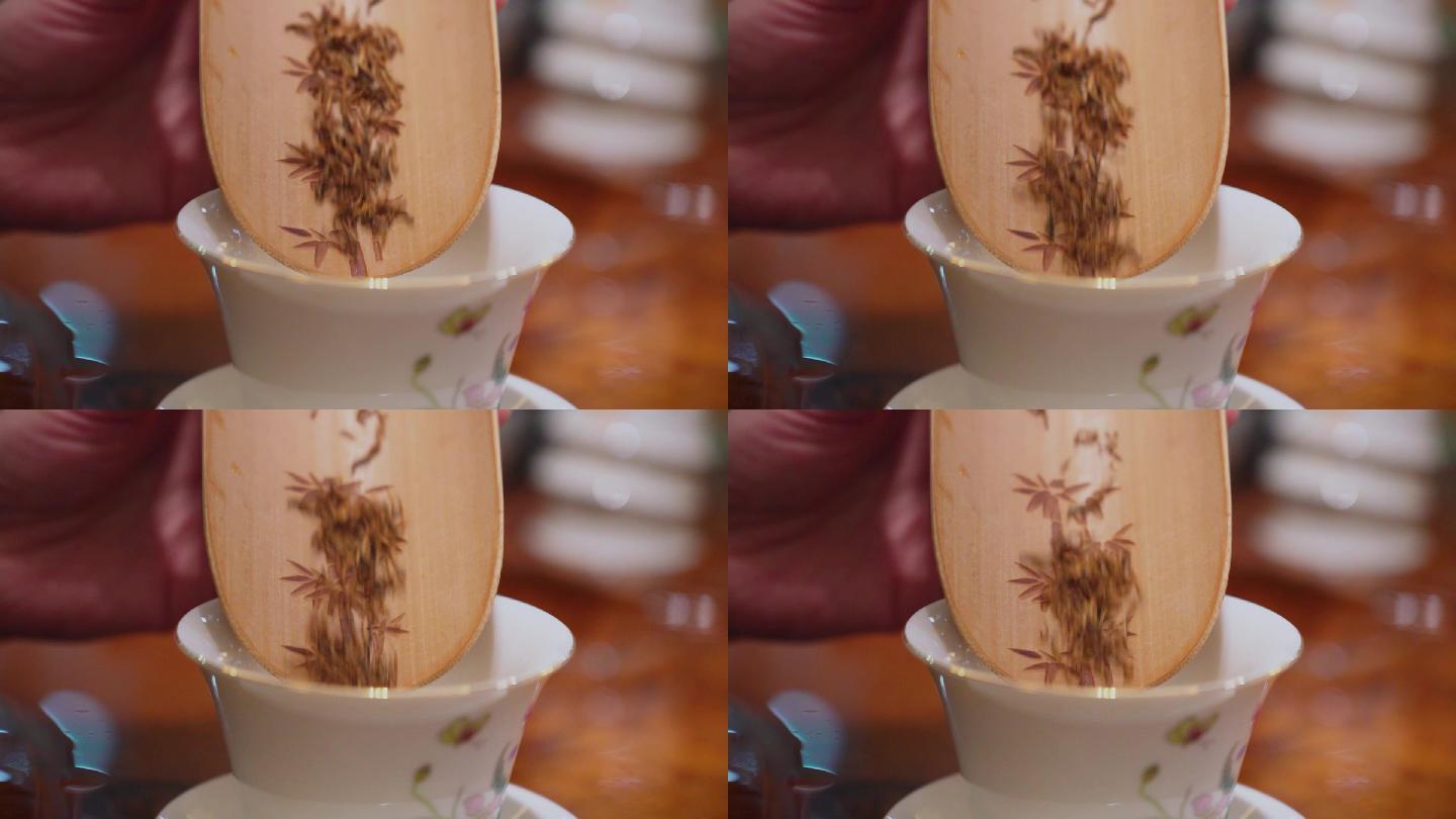 金黄色茶丝导入茶杯高清慢动作视频