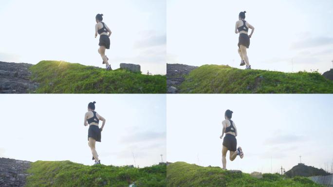 女生山顶跑步户外健身运动登山锻炼攀登高峰