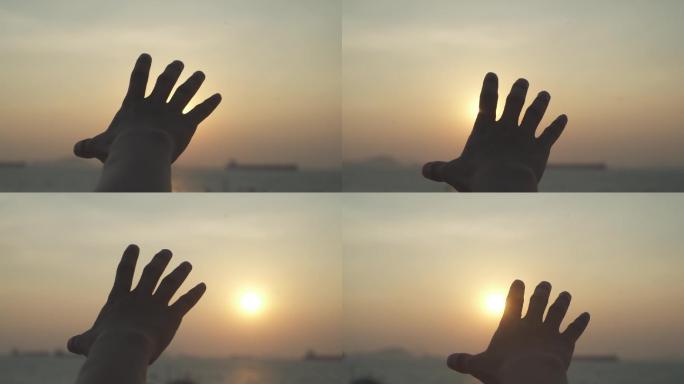 手掌触摸太阳日落希望时间慢一些时光