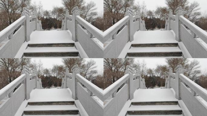 冬天公园下雪降雪公园石桥