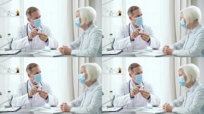 中年男医生戴着口罩向女病人咨询