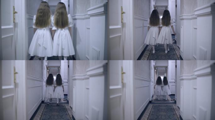 双胞胎在空旷的走廊里慢慢地走着
