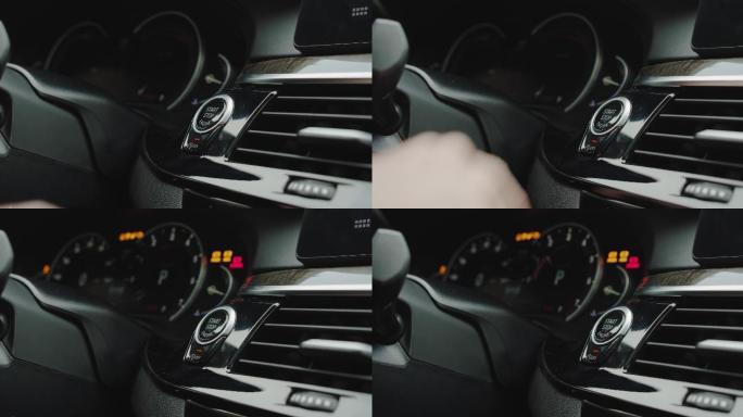 用手指按下按钮启动汽车发动机。