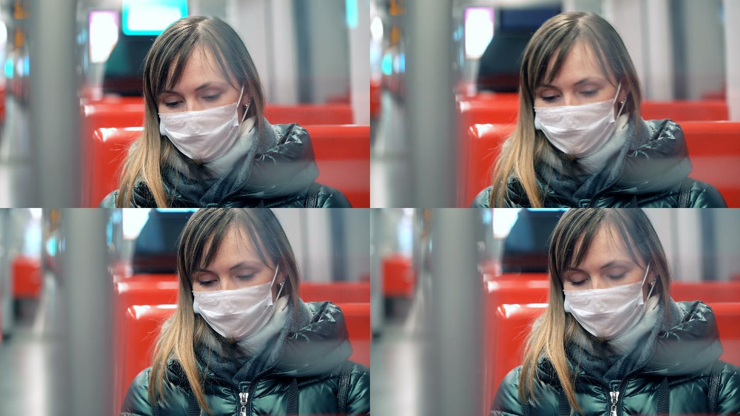 地铁里戴着口罩的年轻女子