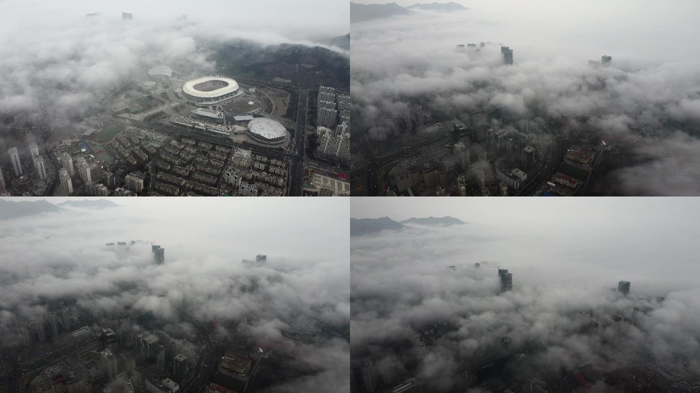 云中的上实中心国信体育馆平流雾