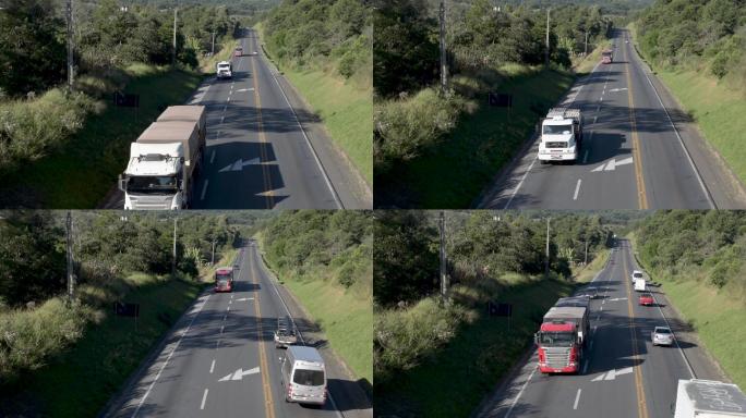 公路上的卡车和轿车。