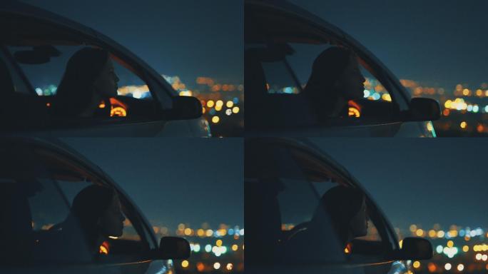 年轻女子坐在车里灯光璀璨车内女人窗外风景