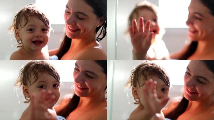 母亲在淋浴后抱着婴儿