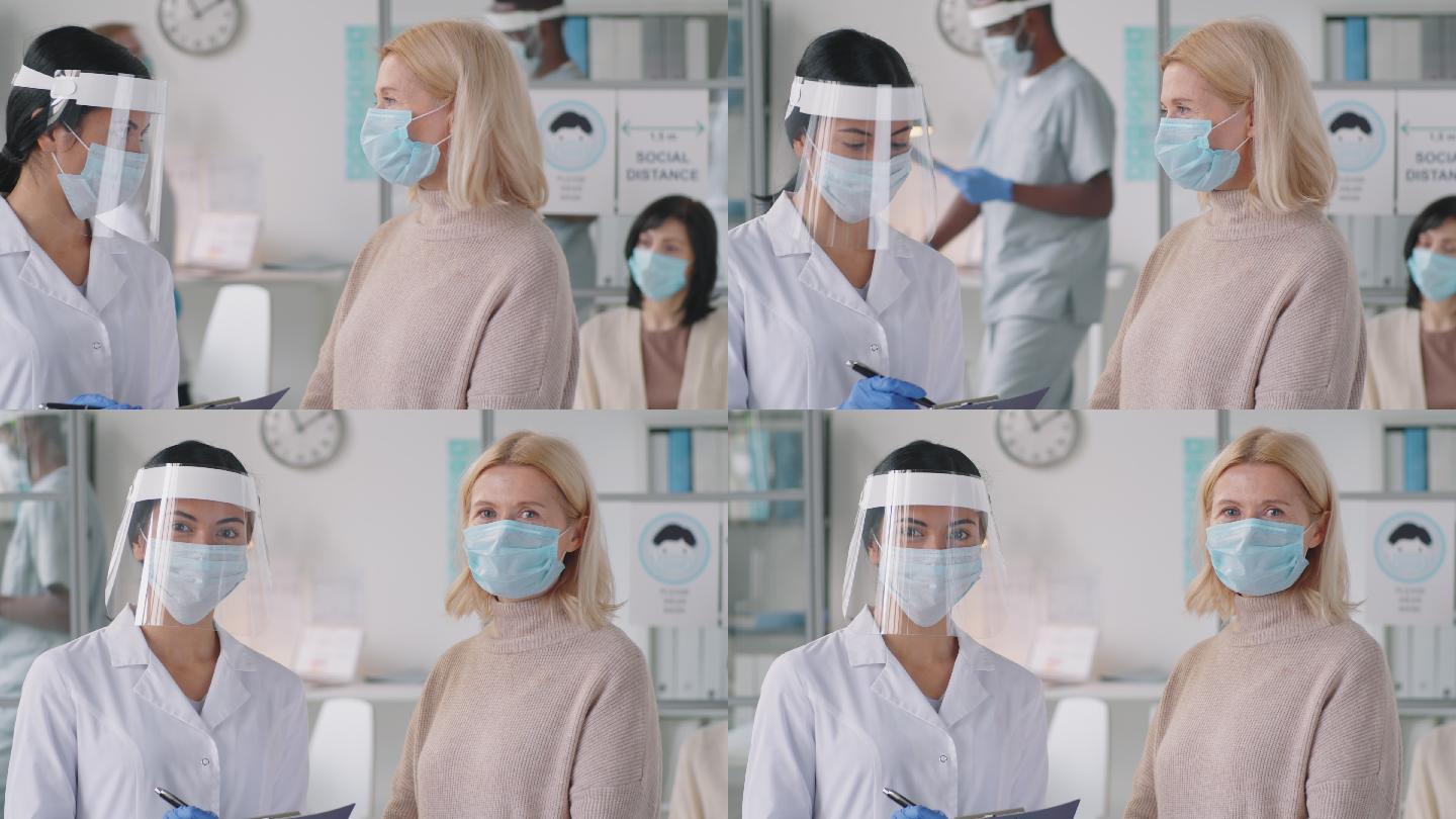 诊所戴防护口罩的女医生和患者肖像