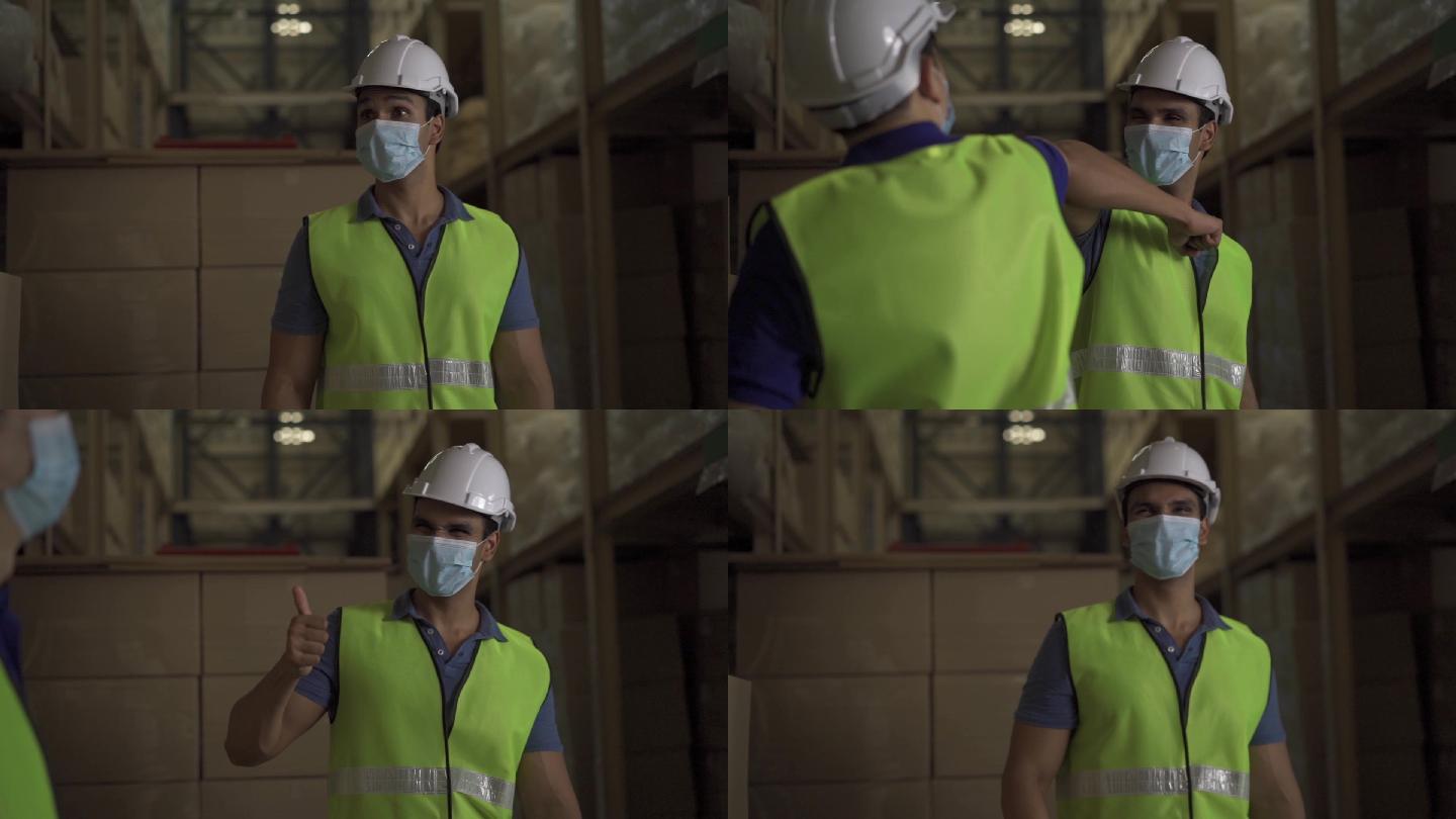男性工厂仓库工人戴口罩在物流行业室内工作