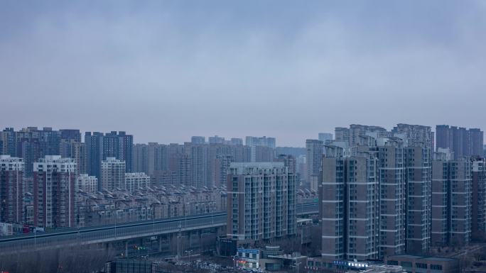 城市建筑楼群早晨天亮阴天夜转日