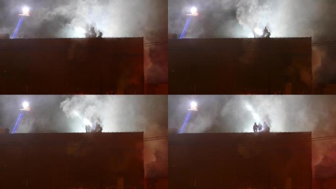 屋顶上的消防队员不畏生死大无畏精神火灾火