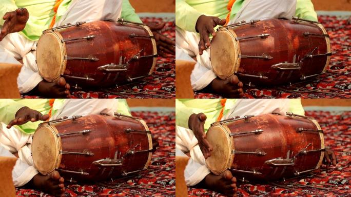 在街上演奏传统印度乐器的鼓手