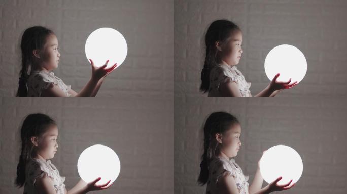 拿着灯的小女孩灯具圆球明亮纯净指引光明孩