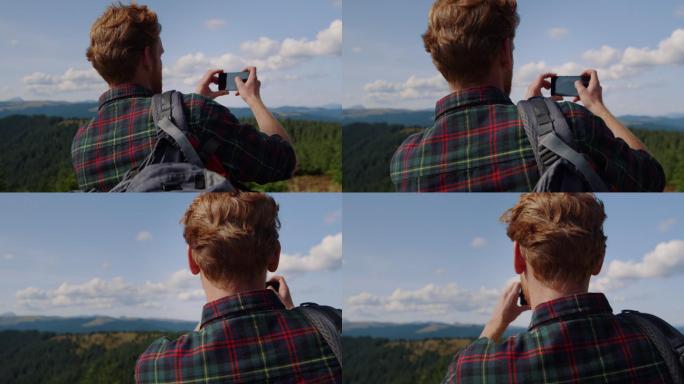男子在山顶拍摄照片