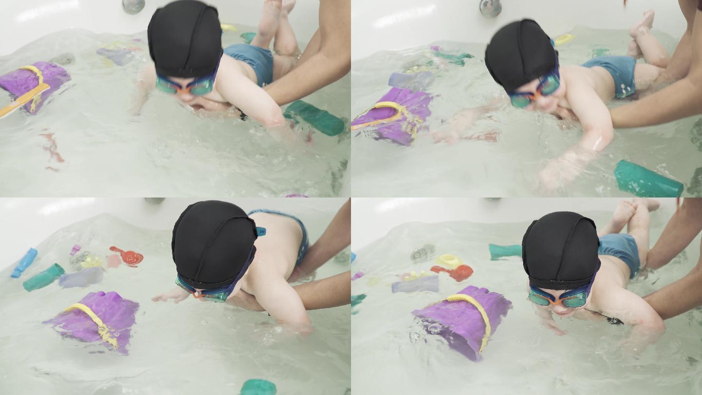 学习游泳的小孩子婴儿亲子互动陪伴家庭温馨