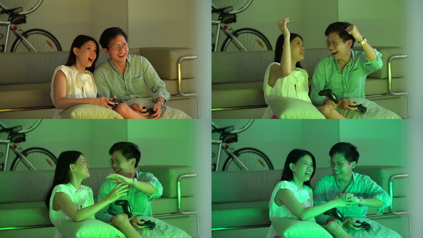 夫妇在家里一起玩游戏机上的电子游戏