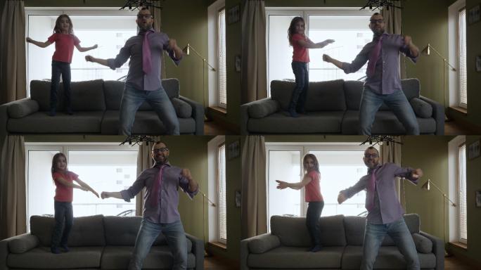 父亲和女儿在家客厅跳舞