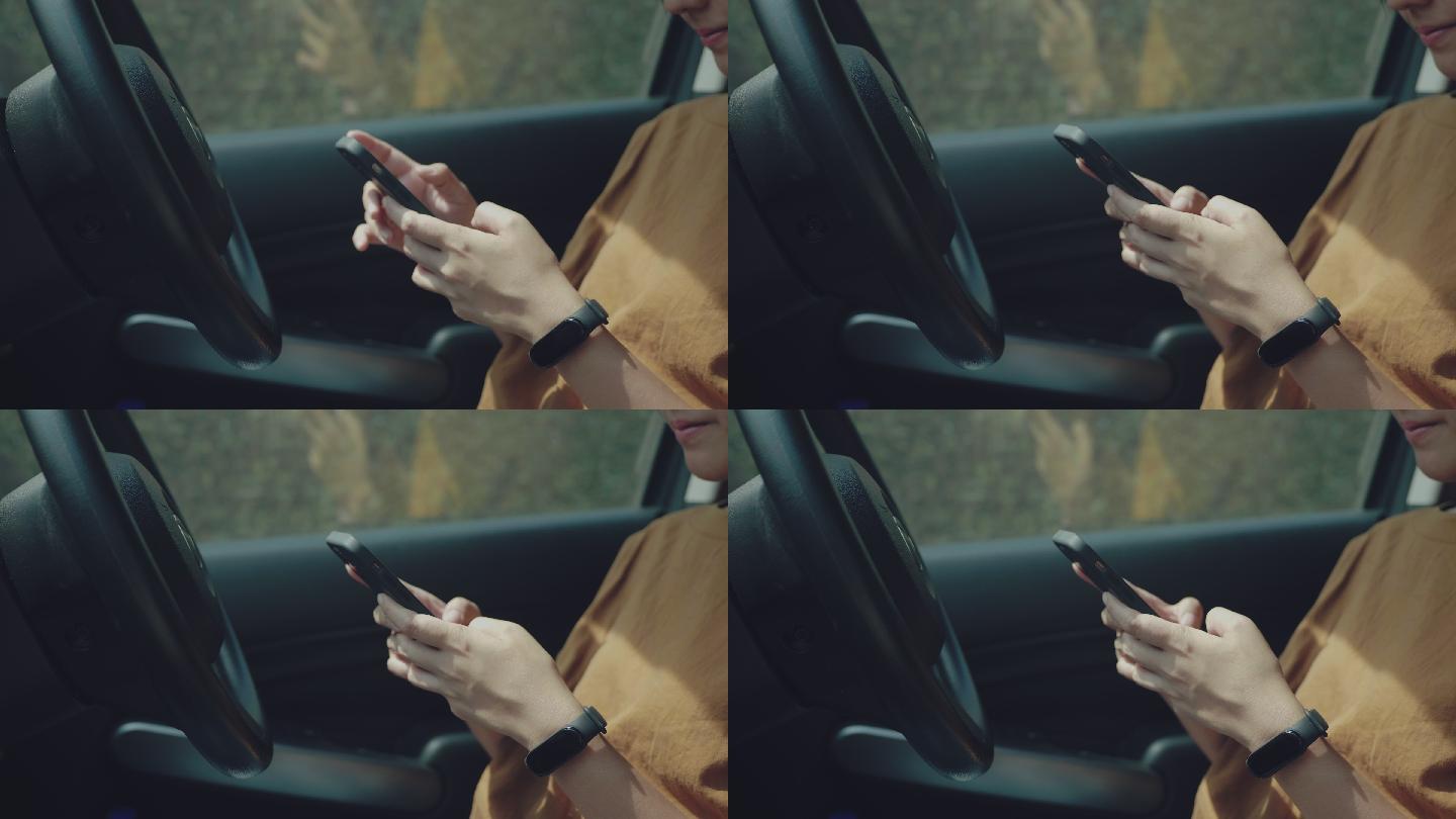 年轻女子在车内使用手机