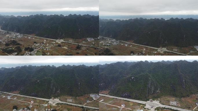 航拍群山脚下山村田野唯美空镜头