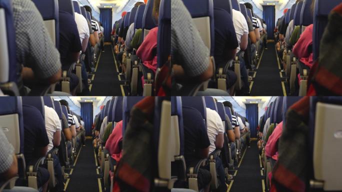 飞机内部座位上的乘客