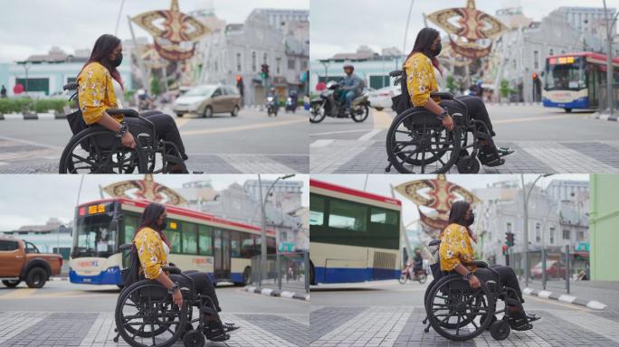 残疾美女坐轮椅穿过城市斑马线