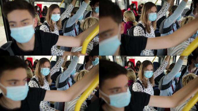 公交车上的乘客戴着防护口罩