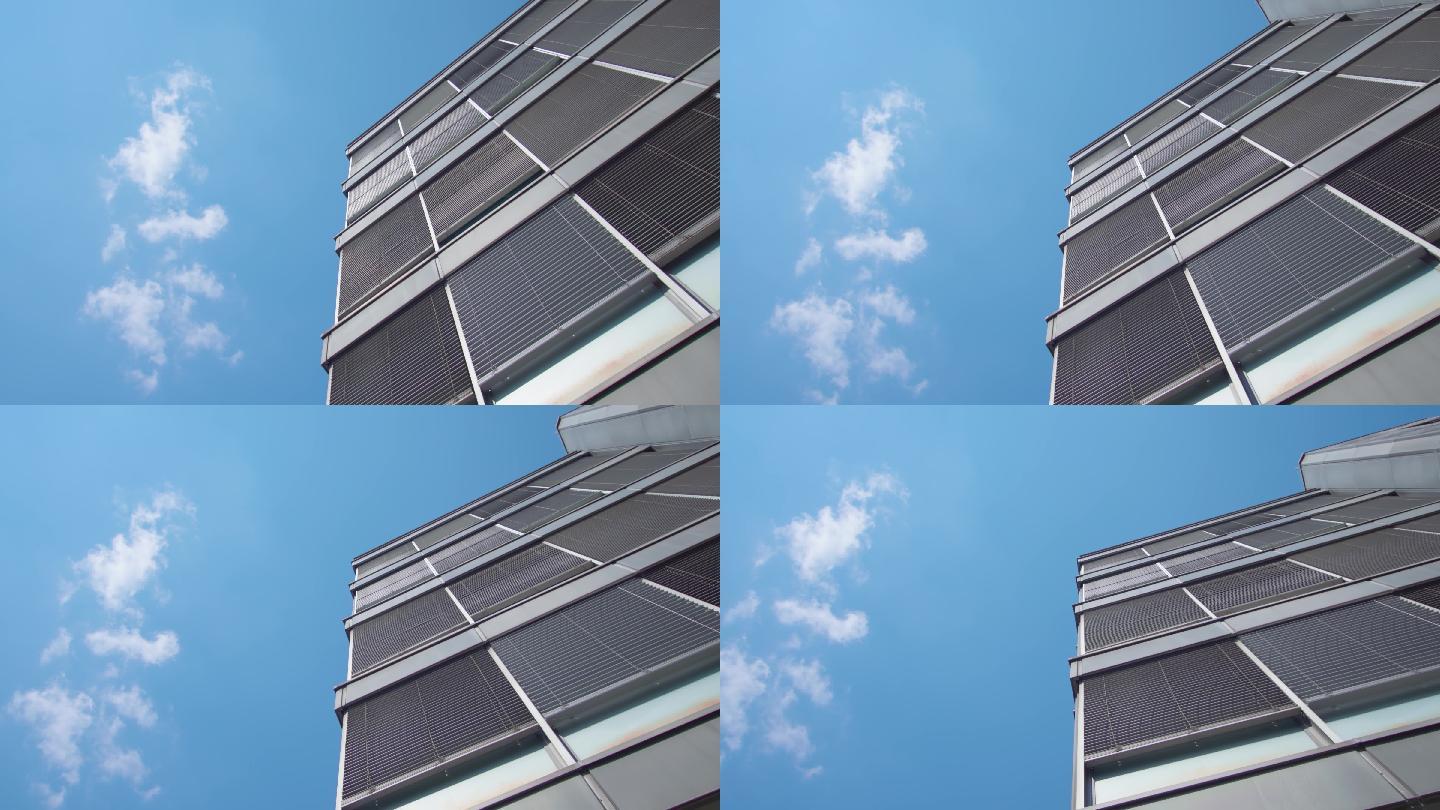 蓝色天空下灰色办公楼