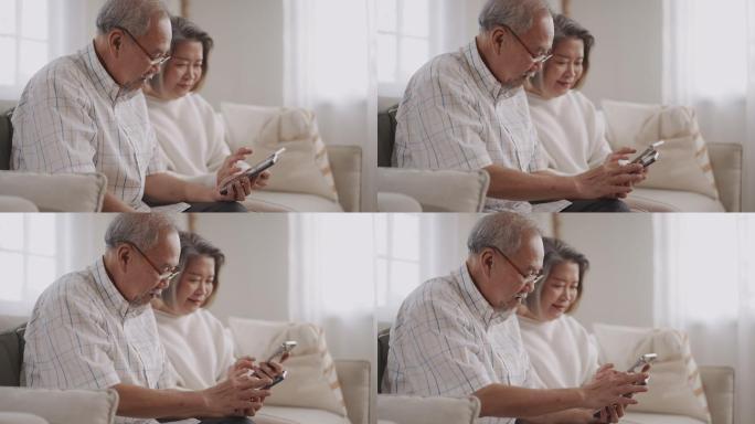 老年男子教妻子使用智能手机