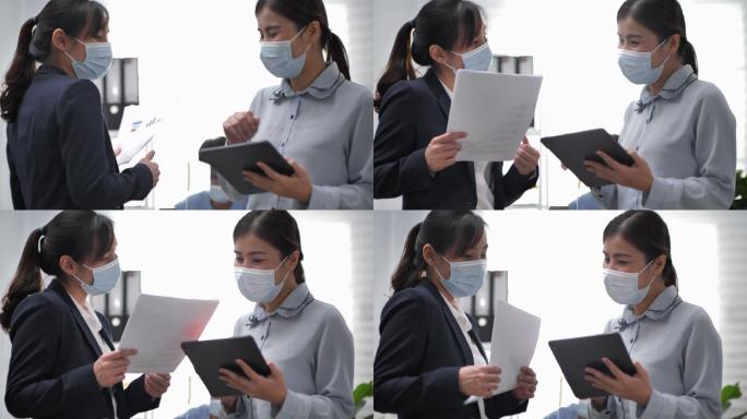 商业女性戴口罩使用肘撞安全问候