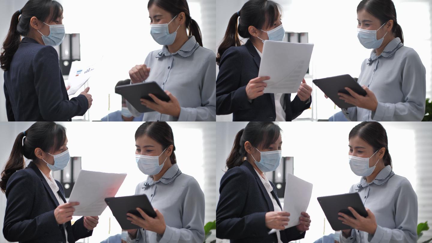 商业女性戴口罩使用肘撞安全问候