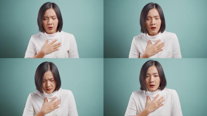 一名女子气喘吁吁地站在蓝色背景下